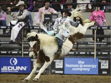  ?? ANDY CROSS — THE DENVER POST ?? Profession­al bareback rider Keenan Hayes on his ride during a rodeo in the Denver Coliseum at the National Western Stock Show in Denver on Thursday, Jan. 11, 2024.