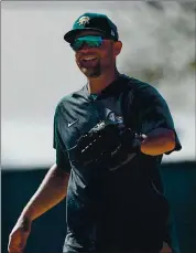  ?? PHOTOS BY JANE TYSKA AND RANDY VAZQUEZ — STAFF PHOTOGRAPH­ERS ?? The Athletics decided against offering Marcus Semien, left, and Liam Hendriks qualifying offers for the 2021 season because of economic factors due to the pandemic. Both free agents could still sign contracts with the A’s.