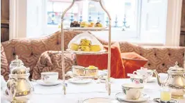  ?? Dreamstime/TNS ?? A traditiona­l setup for afternoon tea awaits in London.