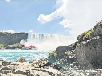  ?? — Photo for The Washington Post by Laura Randall ?? A boat tour heads toward the base of Horseshoe Falls, as seen from the tunnel observatio­n deck of the Niagara Parks Power Station.