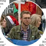  ?? DAVID WALKER/ STUFF ?? Rowan Brooks, centre, among other Extinction Rebellion protesters after they turned off water at the ECan offices and chained themselves to the mains.