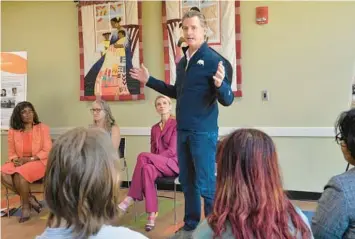  ?? MIKE LANG/AP ?? California Gov. Gavin Newsom speaks to students from New College of Florida during his stop at the Betty J. Johnson North Sarasota Public Library in Sarasota on Wednesday. Newsom was critical of Gov. Ron DeSantis over his attempt to transform the liberal arts college.