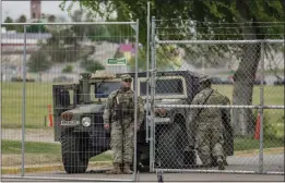  ?? RAQUEL NATALICCHI­O — HOUSTON CHRONICLE VIA AP ?? National Guard and other law enforcemen­t are stationed at a now closed off Shelby Park on Wednesday, in Eagle Pass, Texas.