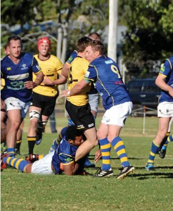  ?? PHOTO: GLEN MCCULLOUGH ?? NOWHERE TO GO: Goondiwind­i fullback George Stacey is sandwiched in the Dalby defence of Sepo Tuitoya and Martin Thompson (nine) during their Risdon Cup qualifying semi-final at John Ritter Oval two weeks ago.