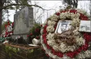  ?? JULIE BENNETT - ASSOCIATED PRESS ?? Wreaths and mementos adorn the grave of Jimmie Lee Jackson at Heard Cemetery in Marion, Ala.