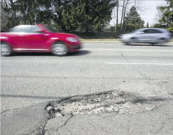  ?? ERNEST DOROSZUK/FILES ?? Believe it or not, municipali­ties often don’t know where potholes are located, writes David Booth.