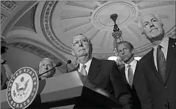  ?? Associated Press ?? Senate Majority Leader Mitch McConnell of Ky., second from left, standing with, from left, Sen. Roger Wicker, R-Miss., Sen. John Thune, R-S.D., and Senate Majority Whip John Cornyn, of Texas, listen to a question during a news conference Sept. 13 on...