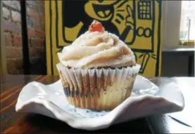  ?? EMILY RYAN — FOR DIGITAL FIRST MEDIA ?? What’s shakin’, bacon? Enjoy a bacon maple cupcake from Dia Doce Gourmet Cupcakes.
