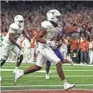  ?? AARON E. MARTINEZ/AMERICAN-STATESMAN ?? CJ Baxter runs for a touchdown in the Sugar Bowl against Washington. He’s expected to be one of the leaders of this year’s running game for Texas.