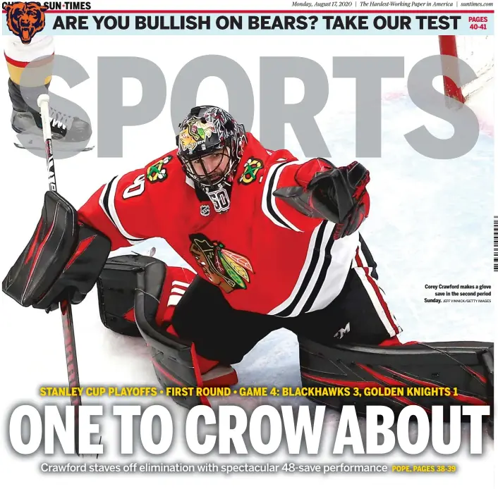  ?? JEFF VINNICK/GETTY IMAGES ?? Corey Crawford makes a glove save in the second period Sunday.