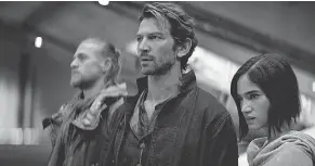  ?? PROVIDED BY NETFLIX ?? Kai ( Charlie Hunnam), with Gunnar ( Michiel Huisman) and Kora ( Sofia Boutella), is full of surprises in “Rebel Moon.”