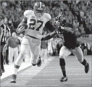  ?? AP/JOHN BAZEMORE ?? Alabama running back Derrick Henry (27) runs past Missouri defensive back Kenya Dennis for extra yardage Saturday during the SEC Championsh­ip Game. Henry finished with 141 yards rushing and two touchdowns in the Crimson Tide’s 42-13 victory.