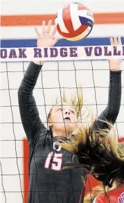  ?? David Hopper / For the Chronicle ?? Oak Ridge middle blocker Hailey Lohnes does her work at the net earlier this season.