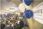  ?? JANIE OSBORNE/GETTY IMAGES ?? Guests at Republican Greg Gianforte’s election party in Bozeman, Montana, wait to hear the outcome Thursday. Gianforte was later declared the winner.