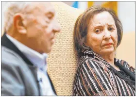  ?? Rachel Aston Las Vegas Review-journal @rookie__rae ?? Holocaust survivor Judy Mack listens as fellow survivor Henry Kronberg on April 1 speaks about his experience and the move of the Sperling Kronberg Mack Holocaust Resource Center to Temple Beth Sholom.