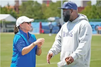  ?? AP PHOTO/GEORGE WALKER IV ?? Tennessee Titans owner Amy Adams Strunk talks with general manager Ran Carthon after a training camp practice this past August in Nashville. Carthon is now also the team’s executive vice president.