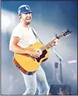  ??  ?? Country singer Luke Bryan performs onstage during the ‘What Makes You Country’ tour stop at Dodger Stadium on July 28, in Los Angeles, California.
(AFP)