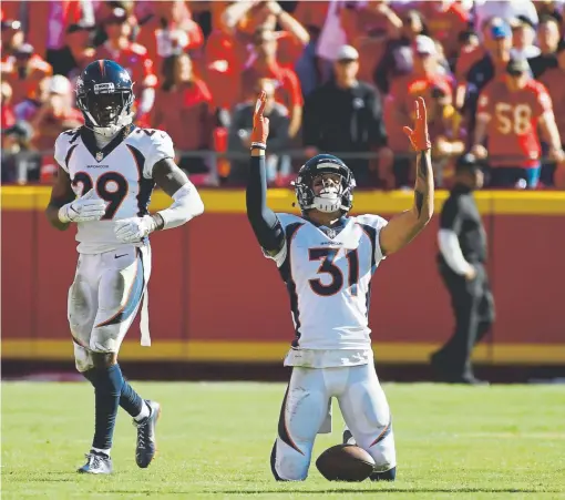  ?? Andy Cross, The Denver Post ?? Broncos free safety Justin Simmons celebrates his intercepti­on against the Kansas City Chiefs in the fourth quarter last month.