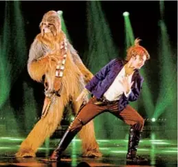  ?? ?? Chewbacca and Han Solo dance in “The Empire Strips Back,” playing through April 30 in San Diego.