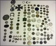  ??  ?? Haul: Coins, buttons and a German iron cross