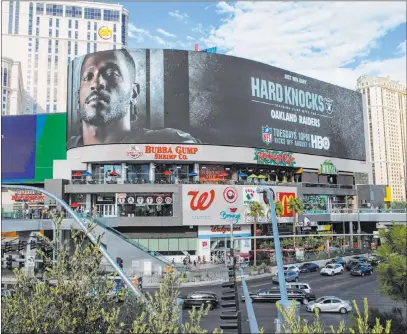  ?? Chase Stevens Las Vegas Review-journal @csstevensp­hoto ?? A digital billboard on Las Vegas Boulevard at Harmon Avenue displays new Raiders receiver Antonio Brown in an advertisem­ent for HBO’S documentar­y miniseries, “Hard Knocks.” The second of five episodes from fall camp in Napa, Calif., airs today.