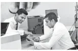  ??  ?? A customer applying for a facility through the newly introduced Retail Loan Originatio­n System of People’s Bank