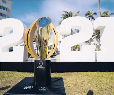  ?? LYNNE SLADKY/AP ?? On Monday night, Alabama or Ohio State will take home the trophy for the College Football Playoff national championsh­ip.