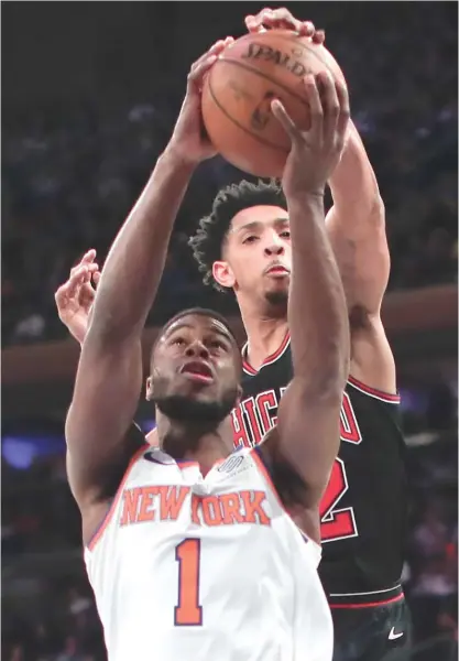  ?? | JULIE JACOBSON/ AP ?? Bulls guard Cameron Payne puts the kibosh on a shot by the Knicks’ Emmanuel Mudiay in the first quarter Monday.