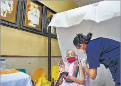  ?? PTI ?? An elderly woman gets inoculated against Covid, at a vaccinatio­n centre in Mumbai on Monday.