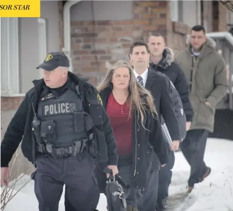  ?? TYLER ANDERSON / NATIONAL POST ?? Forensic anthropolo­gist Kathy Gruspier leaves the Toronto backyard on Thursday where alleged serial killer Bruce McArthur worked.