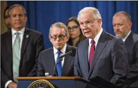  ?? TOYA SARNO JORDAN/GETTY IMAGES ?? U.S. Attorney General Jeff Sessions, joined by Ohio Attorney General Mike DeWine, outlined a plan to target opioid manufactur­ers and distributo­rs.