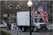 ?? GERALD HERBERT — THE ASSOCIATED PRESS ?? A truck arrives to pick up boxes that were moved out of the Eisenhower Executive Office building inside the White House complex in Washington on Thursday.
