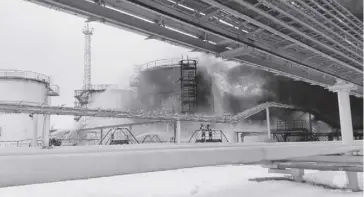  ?? ?? Firefighte­rs extinguish oil tanks at a storage facility that local authoritie­s say caught fire after the military brought down a Ukrainian drone, in the town of Klintsy, Bryansk Region in Russia on Jan. 19, 2024, in this still image taken from video. The Department of Energy said the uptrend in fuel pump prices in the Philippine­s could be attributed to the drone attack.