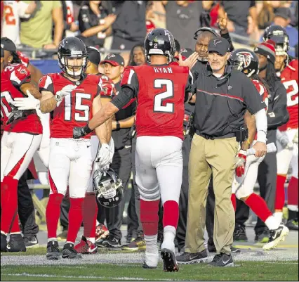  ?? MARK J. TERRILL / AP ?? Quarterbac­k Matt Ryan could lead the 8-5 Falcons to three more wins, against San Francisco, Carolina and New Orleans. Atlanta then might play host to the Giants in the NFC’s wild card round.