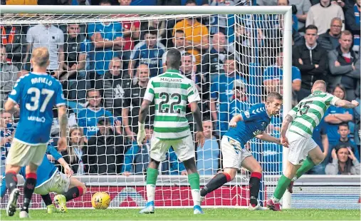  ??  ?? HIT MAN: Jonny Hayes, right, scores for Celtic against Rangers but the former Don is now looking for a new club after leaving the Hoops