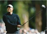  ?? MICHAEL OWENS/GETTY ?? Tiger Woods plays his shot from the second tee during the second round of the the Genesis Invitation­al on Friday at Riviera Country Club in Pacific Palisades, California.