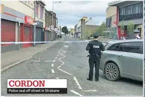  ??  ?? CORDON Police seal off street in Strabane