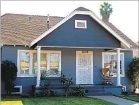  ??  ?? BARGAIN HUNTERS are drawn to the neighborho­od’s cozy Craftsman bungalows, which are often priced below $400,000.