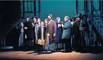  ??  ?? Actors portraying Eastern-European immigrants gather in a scene from “Ragtime” at the Jewish Community Center of Greater Columbus.