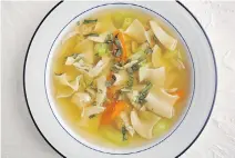  ?? DEB LINDSEY/THE WASHINGTON POST ?? A bowl of homemade chicken soup is both comforting and light, making it satisfying at any time of year.