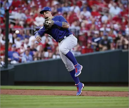  ?? JOE PUETZ - THE ASSOCIATED PRESS ?? Chicago Cubs shortstop Javier Baez throws out St. Louis Cardinals’ Yadier Molina during the second inning of a baseball game Wednesday, July 21, 2021, in St. Louis.