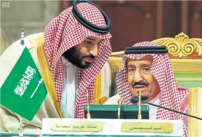 ?? THE ASSOCIATED PRESS FILE PHOTO ?? Senior staffers for Saudi Arabia’s sovereign public investment fund are jumping ship once they realize they have little influence over strategy at a fund dominated by Crown Prince Mohammed bin Salman, seen here with his father, King Salman.