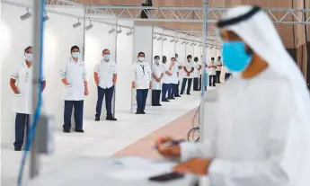  ?? WAM ?? At the earliest stage of the outbreak, the UAE transforme­d huge exhibition centres such as the Dubai World Trade Centre into field hospitals. It also set up quick drive-through centres.