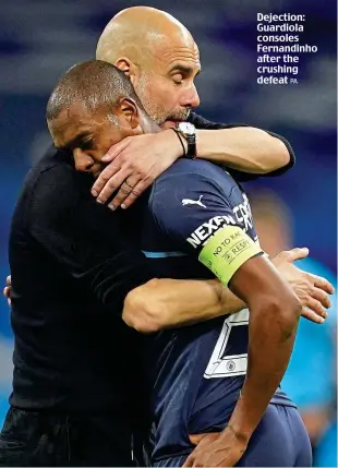  ?? PA ?? Dejection: Guardiola consoles Fernandinh­o after the crushing defeat