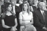  ?? AP/EVAN VUCCI ?? Melania Trump (from front left), Ivanka Trump and vice presidenti­al candidate Mike Pence wait for the presidenti­al debate to begin Monday night at Hofstra University in Hempstead, N.Y.