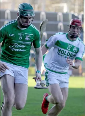  ??  ?? Naomh Eanna’s Jack Cullen is chased by Shamrocks forward Adrian Mullen.