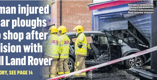  ?? KEVIN SCOTT ?? Emergency services at the
scene of the accident on Belfast’s Andersonst­own Road yesterday