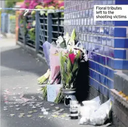  ??  ?? Floral tributes left to the shooting victims