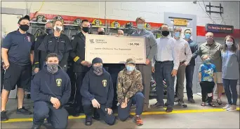  ?? SUBMITTED PHOTO ?? Energy Transfer presents a check for $34,700 this week to the Lower Chichester Volunteer Fire Department.