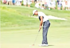  ??  ?? Tiger Woods, playing his 11th US PGA event in a comeback from spinal fusion surgery, made four birdies in a row and sank a 25-foot birdie putt at the ninth on June 30, 2018. - AFP photo